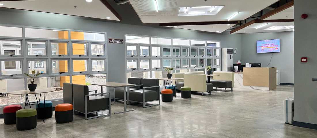 University of Mindanao learning commons with students at collaborative tables