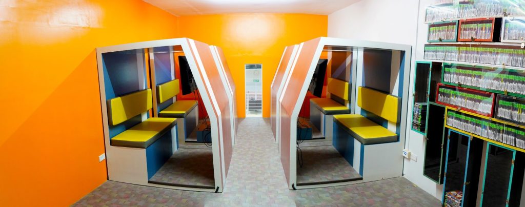 Rows of colorful enclosed study booths in blue and yellow
