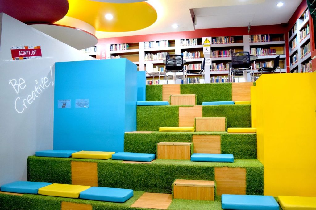Tiered creative nook with cushioned astroturf steps