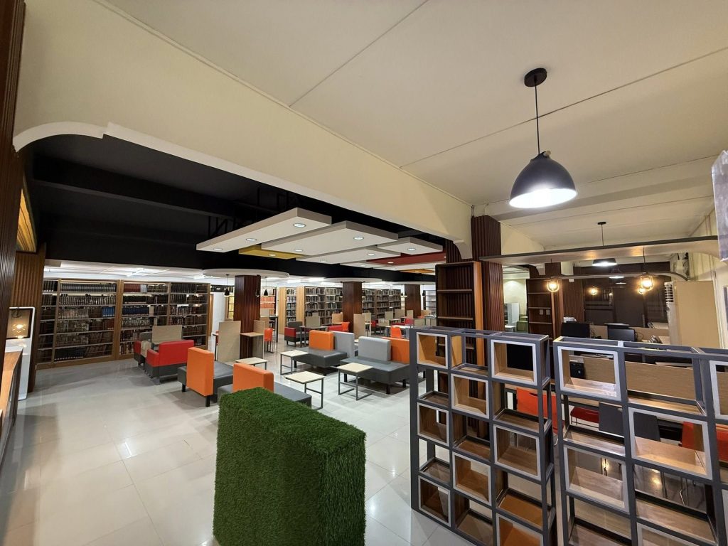 Quiet reading nook with booth seating tucked among the library stacks