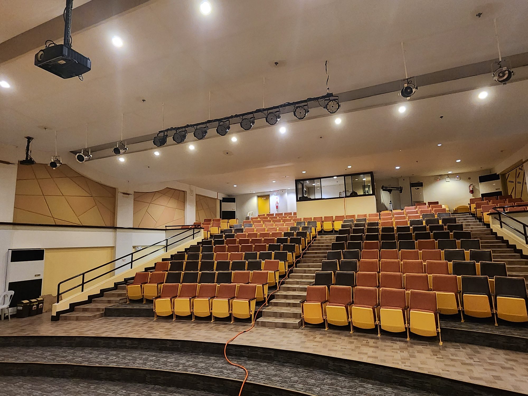Lecture theater with tiered orange seating