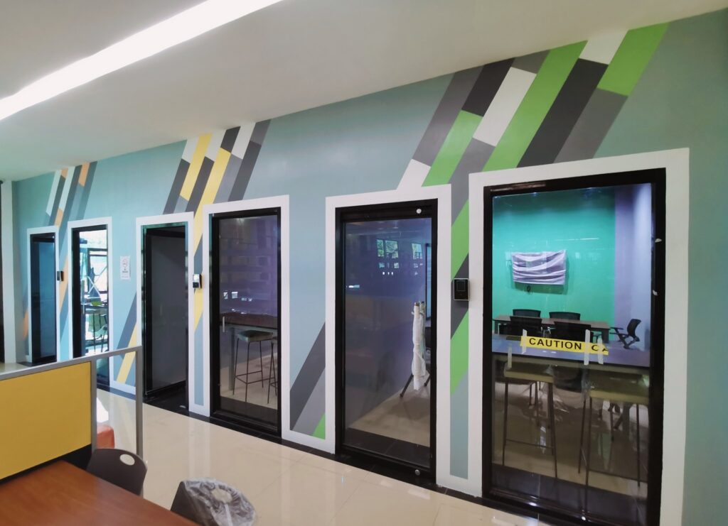 Students studying at tables in the open learning commons