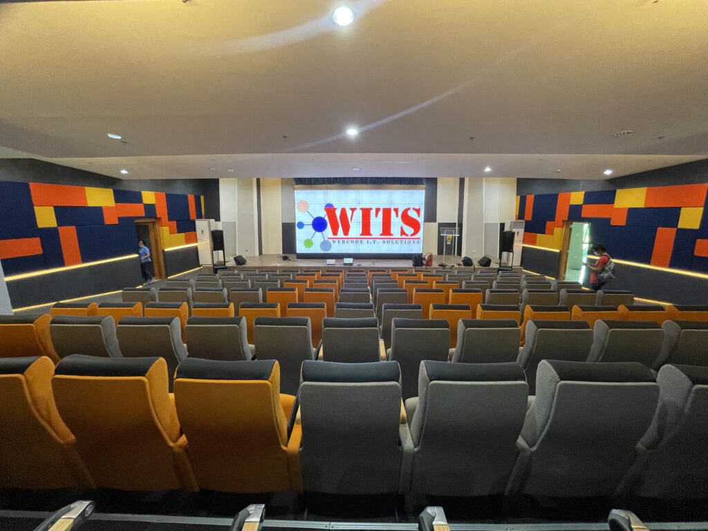 Tiered reading amphitheater with colorful cushioned steps and motivational wall graphics at CSU-HERO Learning Commons